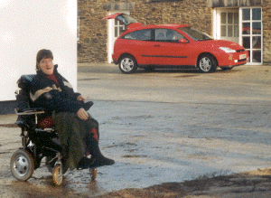 Car parked outside flat showing wheelchair access